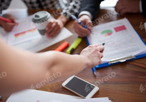 Preview: Woman pointing at the documents