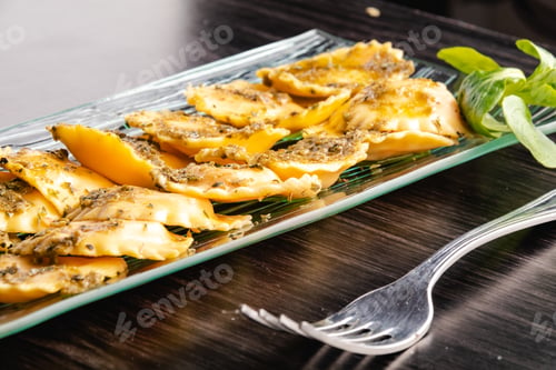 Preview: Italian stuffed pasta ravioli with pesto sauce