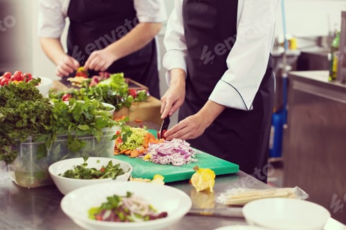 Preview: team cooks and chefs preparing meals