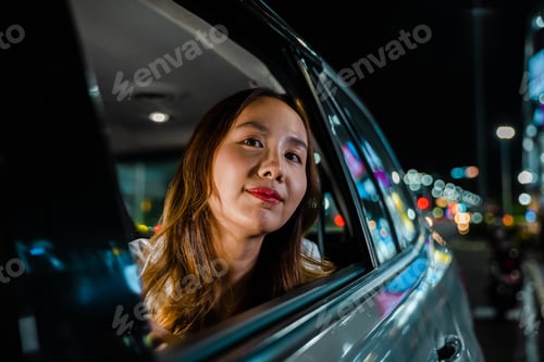 Preview: Traveling through the night city streets, the woman in the car gazes out the window at the scenery