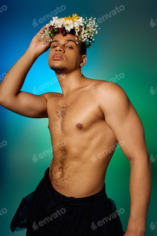 Preview: Young African American man with dyed hair displays fashion in a vibrant studio