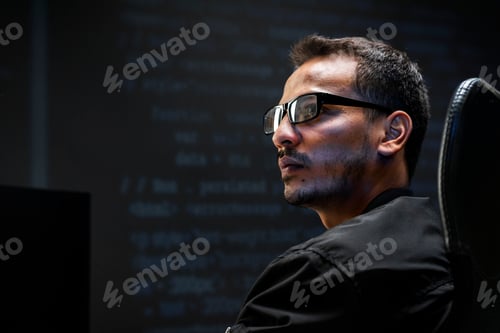 Preview: Man analysing binary code on virtual screen
