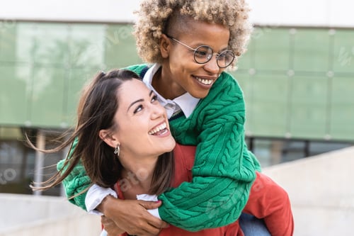 Preview: Happy multiracial female friends having fun together outdoor together - Focus on african girl face