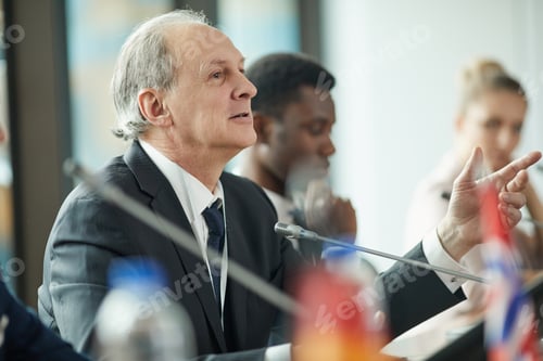 Preview: Senior businessman at conference