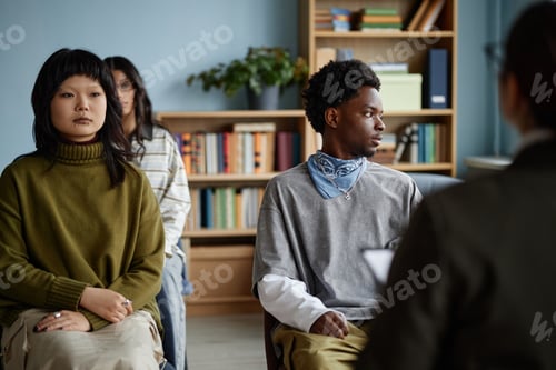Preview: Diverse Teenagers Attending Counseling Session with Therapist in Office