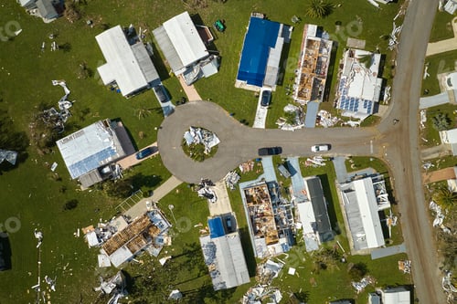 Preview: Severely damaged houses after hurricane Ian in Florida mobile home residential area.