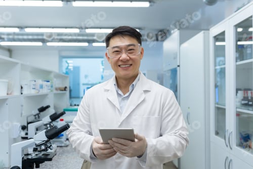 Preview: Portrait of a young Asian medical student. a scientist, a chemist who stands in the waiting room in