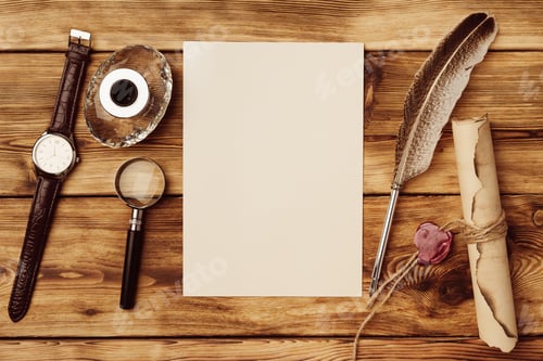 Preview: Old paper on brown wood background with feather