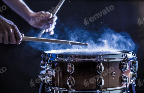 Preview: Man plays musical percussion instrument with sticks, a musical concept.