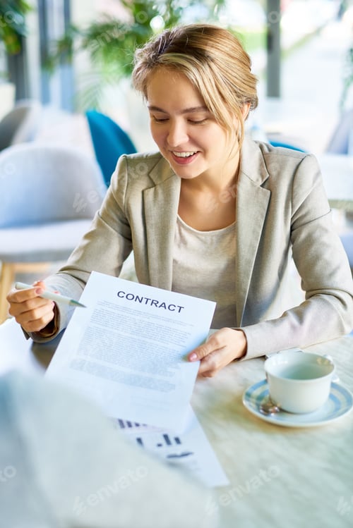 Preview: Young Business Woman Presenting Contract