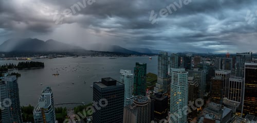 Preview: Aerial view of Downtown City during a stormy summer evening before sunset