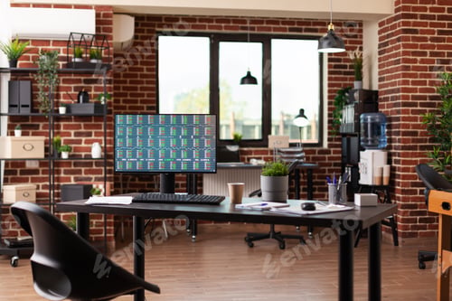 Preview: Monitor showing stock market statistics in business office