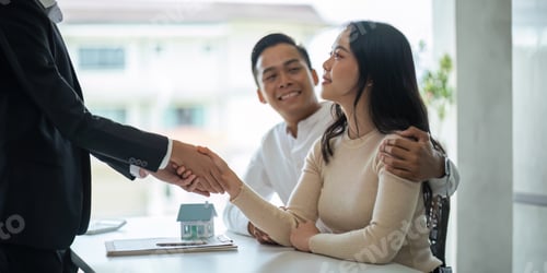 Preview: Young Asian couple making contract with house sale agency. man and his wife sitting signing the