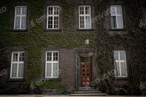 Preview: Beautiful old window on a brick wall background of an old house.