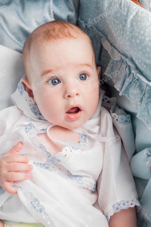 Preview: Cute Infant with Eyes Open Lying Down