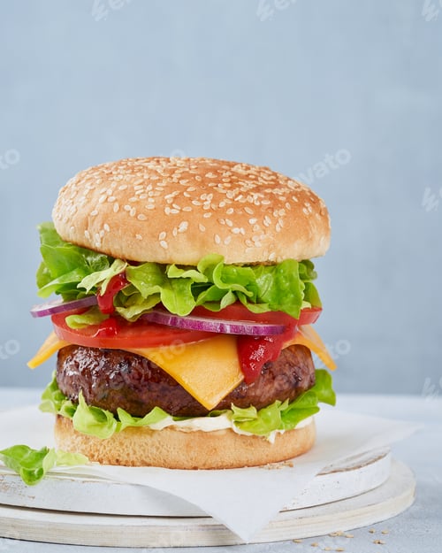 Preview: Burger, Cheeseburger, Hamburger, close up on a light blue background, copy space. Fast food.