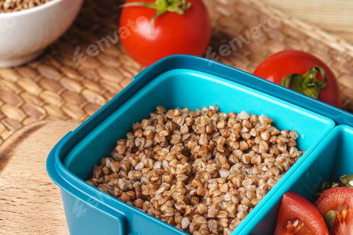 Preview: Blue lunch box with buckwheat and tomatoes