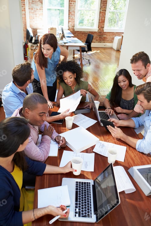 Preview: Group Of Office Workers Meeting To Discuss Ideas