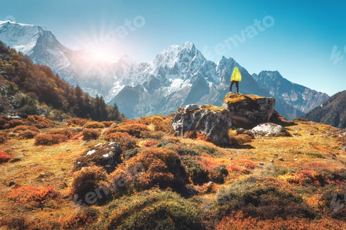 Preview: Man on the stone and mountains at sunset in Nepal