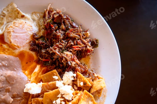 Preview: Scrambled eggs with machaca and beans and chilaquiles