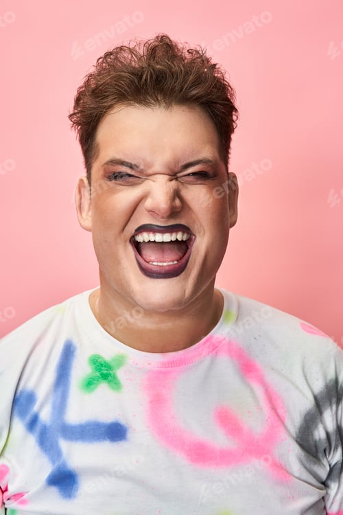 Preview: Vibrant expression of joy with bold makeup and colorful attire celebrating LGBTQ pride