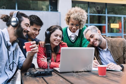 Preview: Creative multi-cultural professionals on online video call with laptop, microphone outdoors