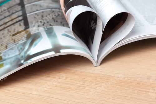 Preview: Pages of book curved into a heart shape, close up