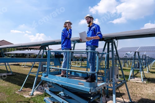 Preview: Maintenance engineer at solar farm stand on scissor lift inspection solar panel and radio report