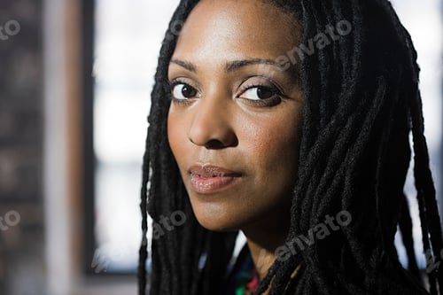 Preview: Confident woman with dreadlocks facing the future
