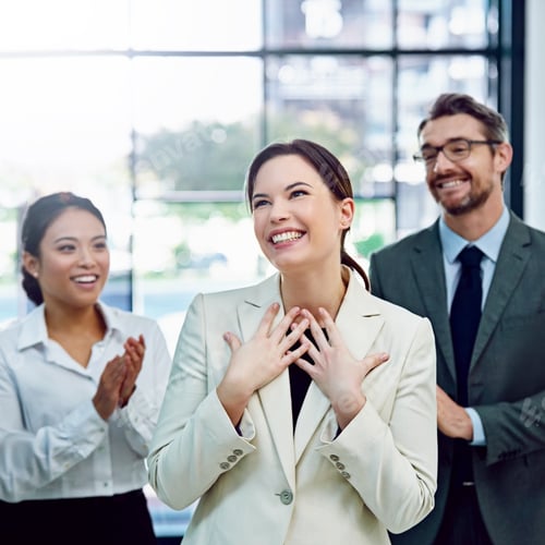 Preview: Shot of a succesful businesswoman being applauded by her colleagues in the office