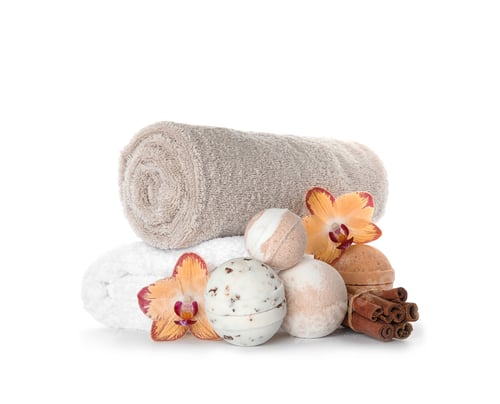 Bath Bombs, Cinnamon Sticks and Flowers on White