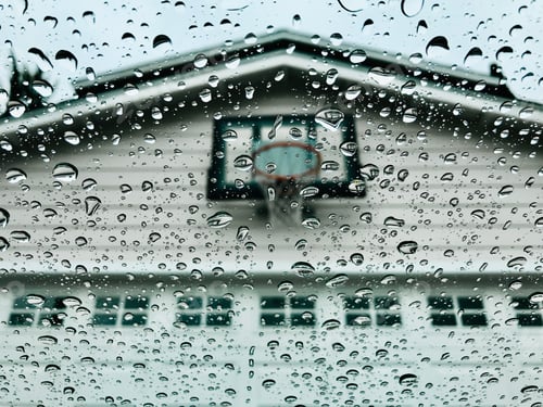 Preview: Looking out the window at the basketball hoop on a rainy day