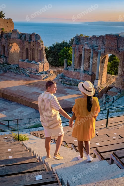 Preview: Taormina Sicily, couple watching sunset at the Ruins of the Ancient Greek Theater
