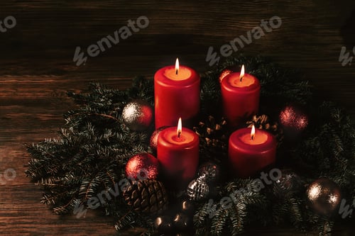 Preview: Red candles in advent wreath decoration on wooden dark background