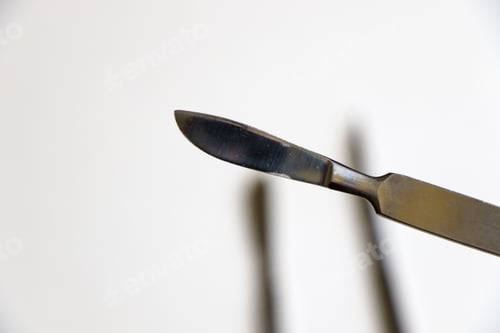 Preview: Surgery blade on sterile white background