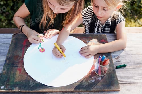 Preview: Sisters colouring out in garden