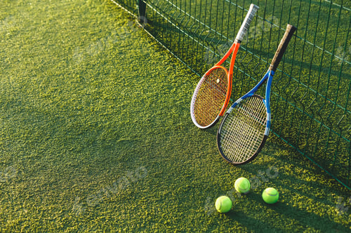 Preview: Tennis rackets on grass