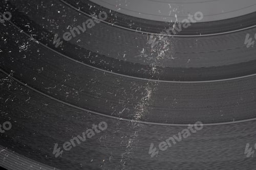 Preview: Close-up shot of LP vinyl record groove with dust and dirt