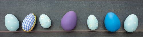 Preview: Happy Easter. Blue pastel color eggs variety on blue wooden background