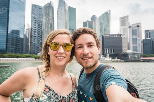 Preview: Tourists posing in front of Singapore skyline, Marina Bay