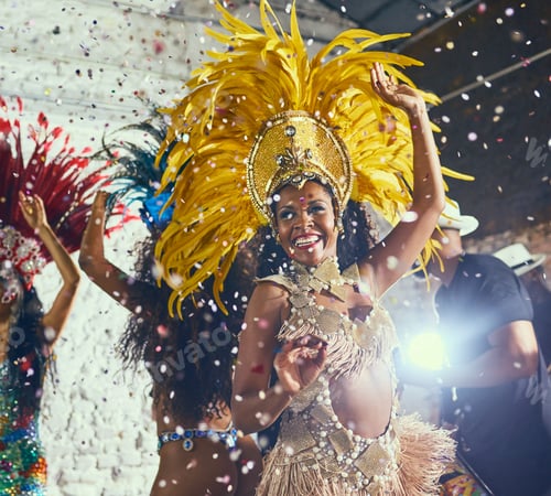 Preview: Cropped shot of beautiful samba dancers performing in a carnival with their band