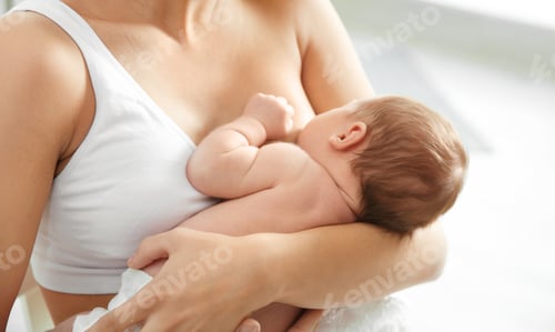 Preview: Young woman breastfeeding her baby on blurred background, closeup