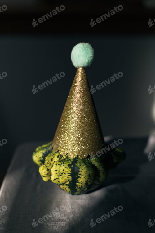 Preview: A cucurbit green pumpkin with a party hat on