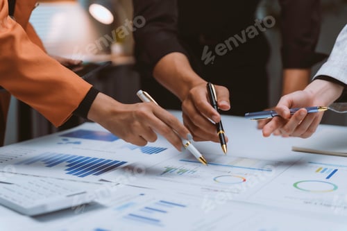 Preview: Business Team Analyzing Charts During Office Meeting