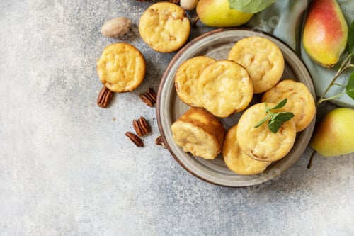 Preview: Homemade sweet cottage cheese muffins with pear stuffing, cinnamon and pecan.