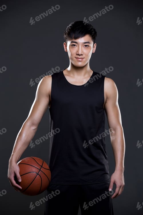 Preview: Young man holding a basketball
