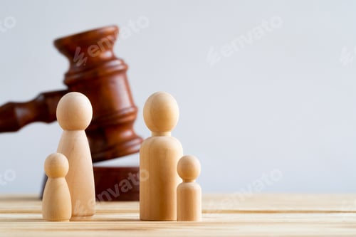 Preview: Wooden toy family and judge mallet. Family divorce concept