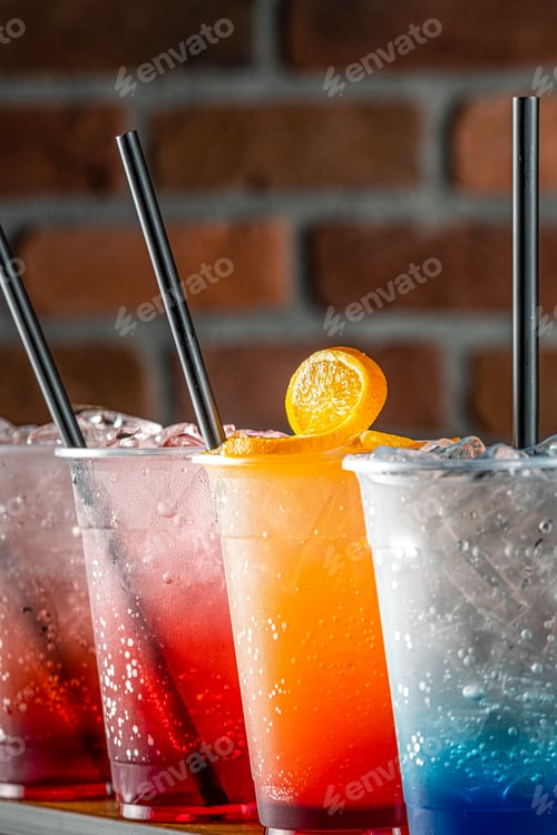 Preview: Colored mojito drink with different flavors on a red brick background