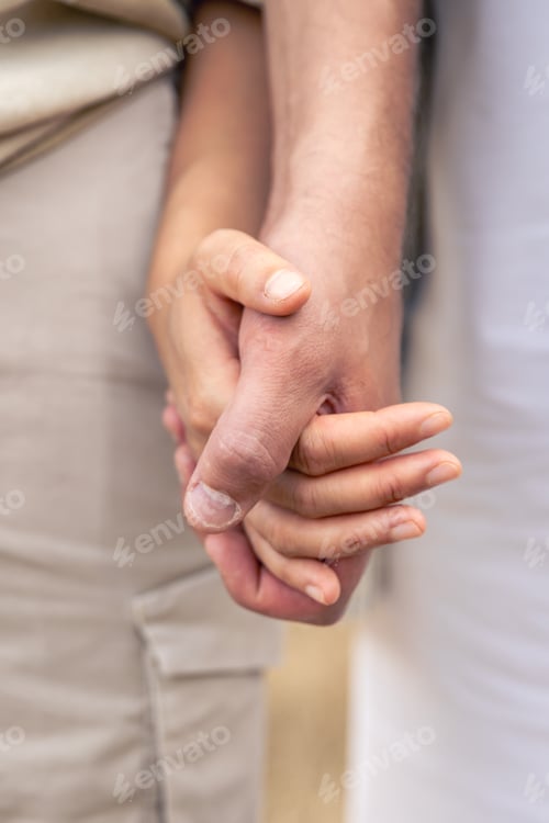 Preview: Close up of a couple holding hands, hand-in-hand, couple love.