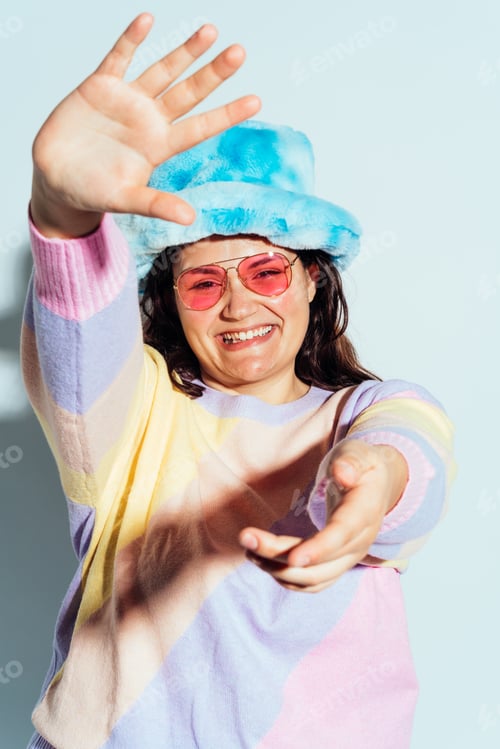 Preview: Plus size woman model posing in studio and having fun.